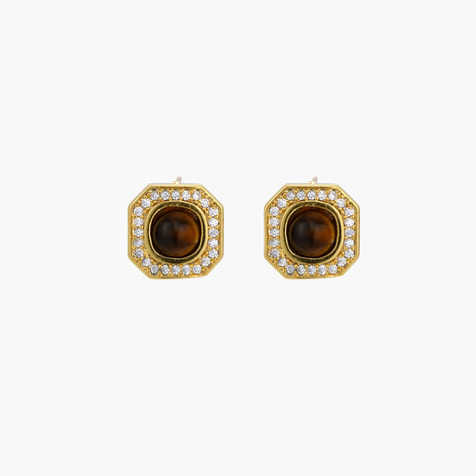 Gold-plated octagonal stud earrings with brown tiger's eye centers and cubic zirconia border on cream background.