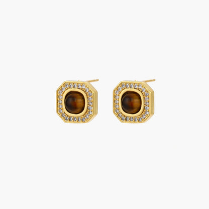 Gold-plated octagonal stud earrings with brown tiger's eye centers and cubic zirconia border on cream background.
