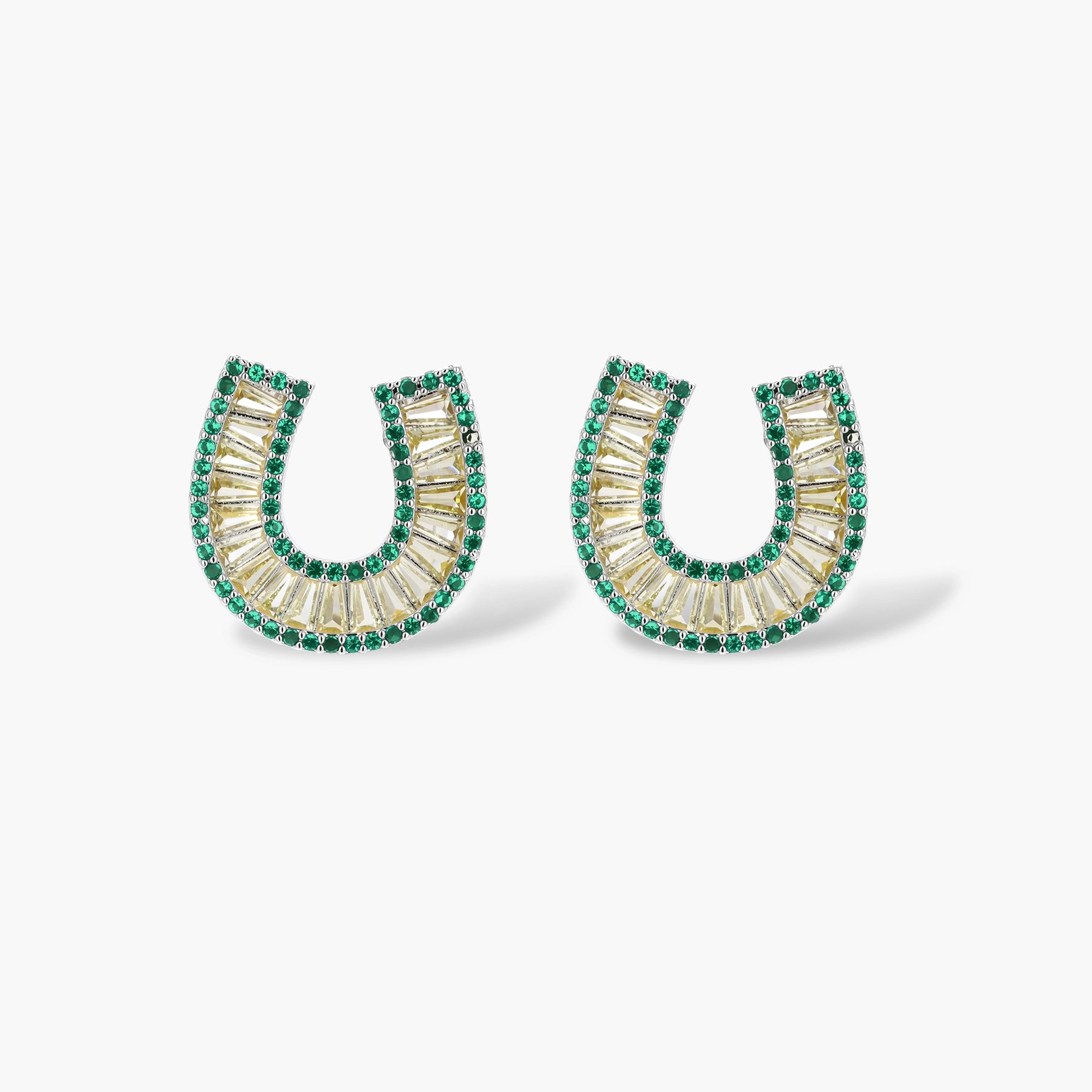 Sparkling horseshoe-shaped jewelry set with AAA cubic zirconia in gold-plated and white gold finishes on cream background.