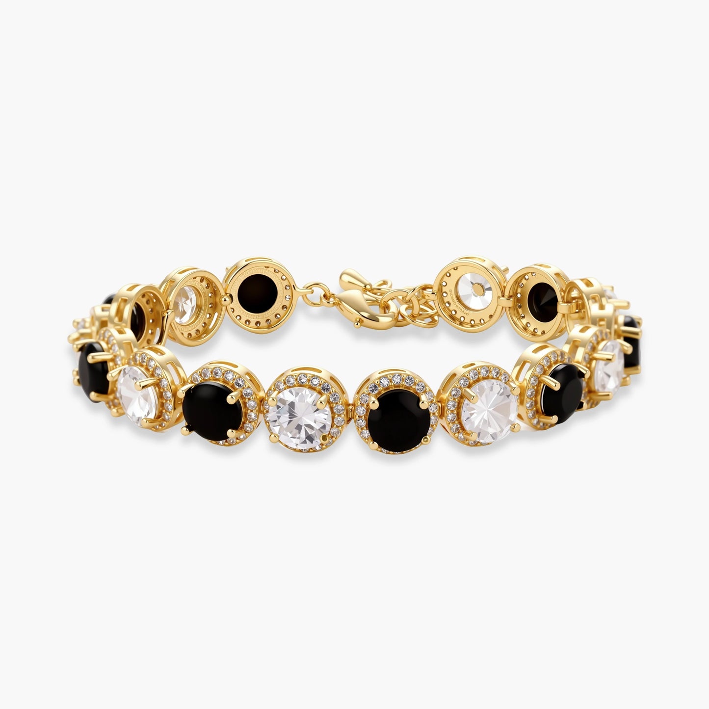 Gold-plated jewelry set with alternating black and clear cubic zirconia stones, featuring necklace, earrings and bracelet