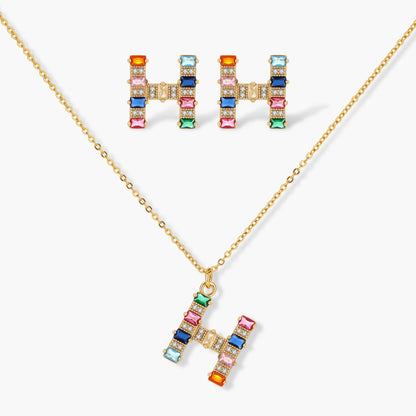 Letter H jewelry set featuring geometric crystal design in gold and white gold plated finish with adjustable chain necklace