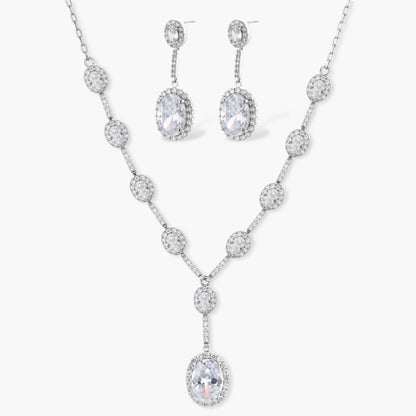 Elegant white gold plated jewelry set with oval cubic zirconia stones in halo settings, featuring Y-necklace and drop earrings.