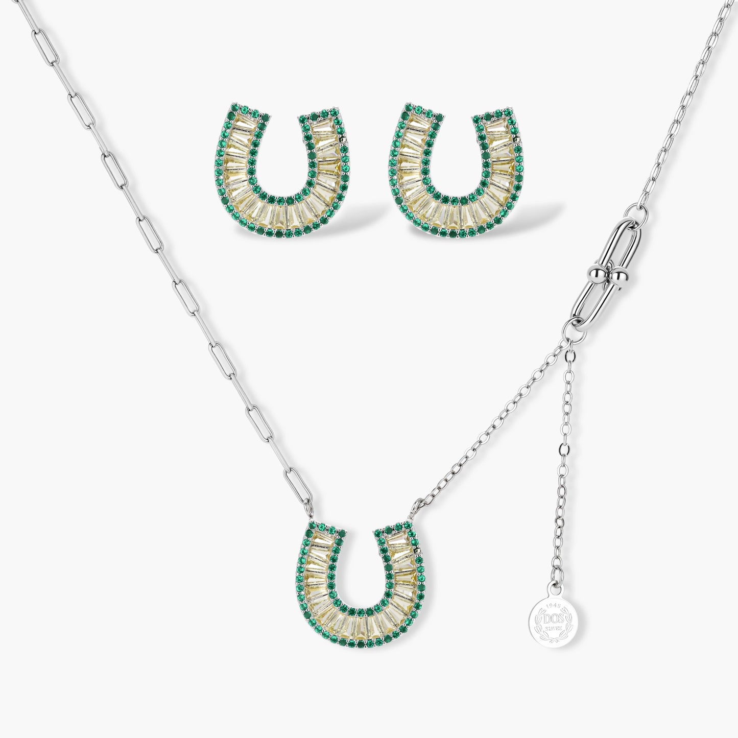 Sparkling horseshoe-shaped jewelry set with AAA cubic zirconia in gold-plated and white gold finishes on cream background.