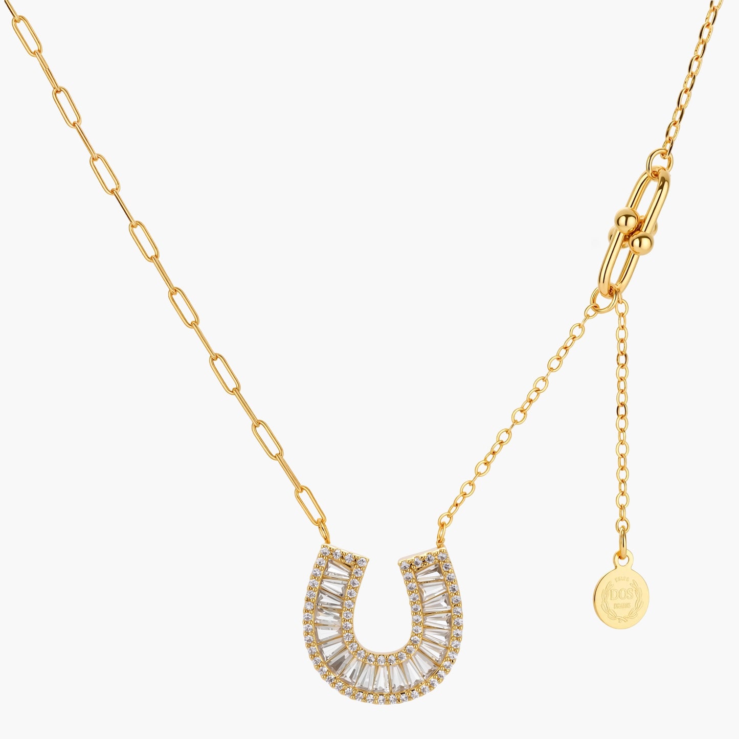 Sparkling horseshoe-shaped jewelry set with AAA cubic zirconia in gold-plated and white gold finishes on cream background.