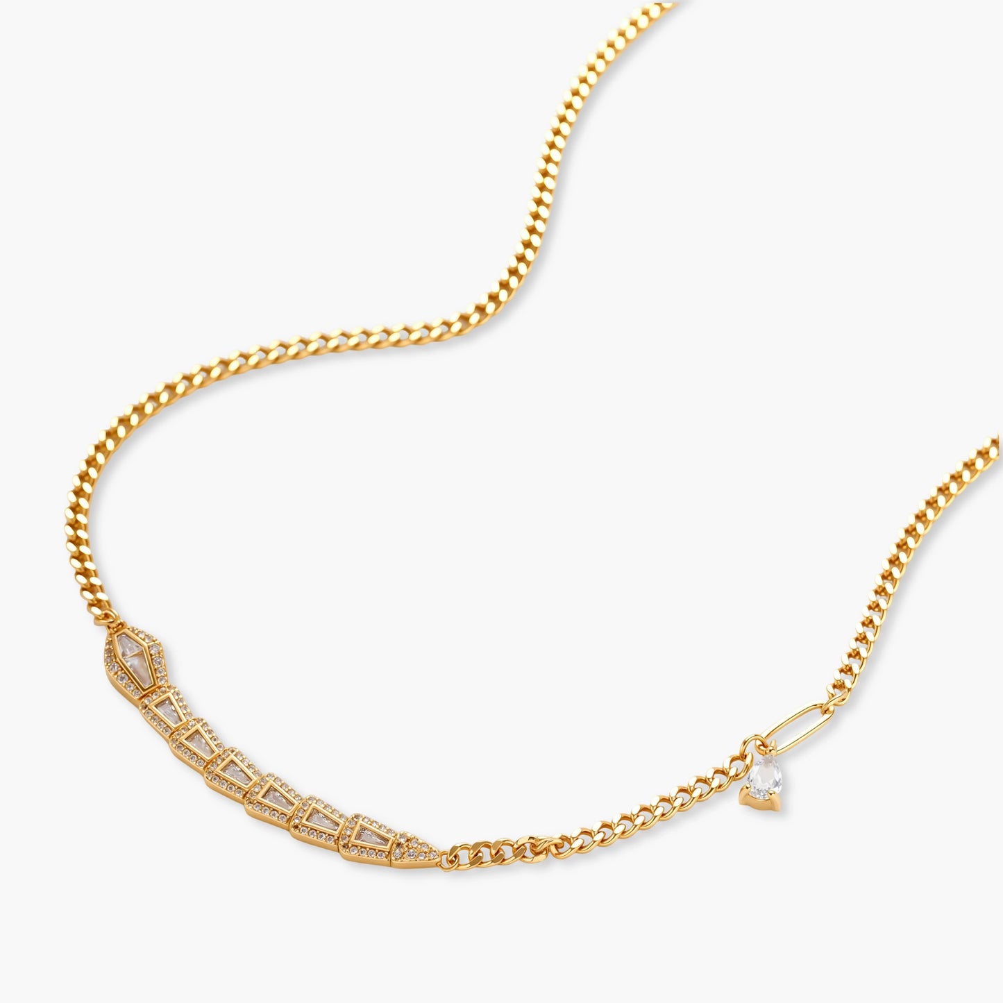 Gold-plated necklace with geometric diamond segments and matching huggie earrings featuring cubic zirconia details