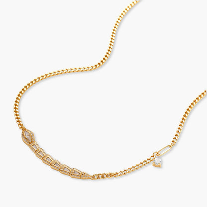 Gold-plated necklace with geometric diamond segments and matching huggie earrings featuring cubic zirconia details