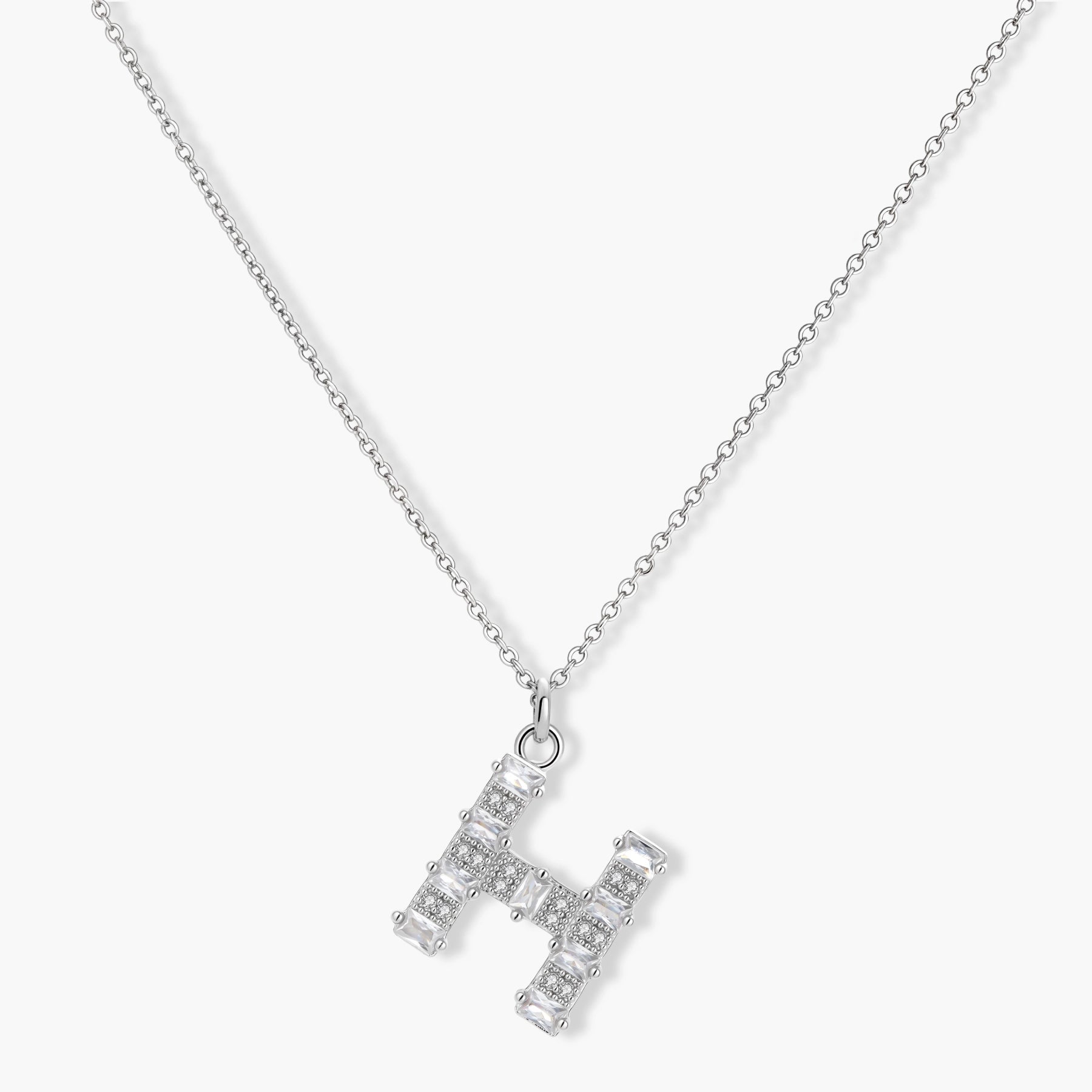 Letter H jewelry set featuring geometric crystal design in gold and white gold plated finish with adjustable chain necklace