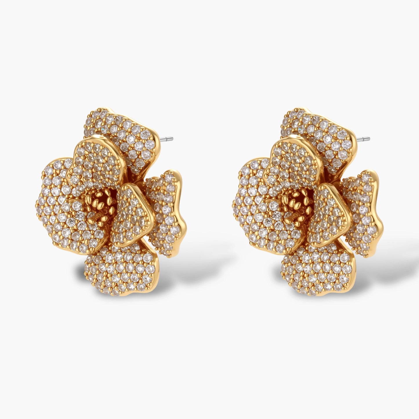 14K gold-plated floral jewelry set with blue cubic zirconia centers and pearl chain details on white background.