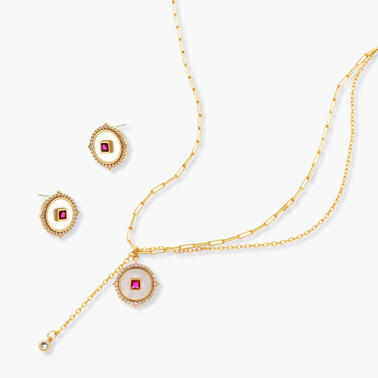 Gold-plated circular medallion necklace set with white enamel base and pink cubic zirconia accent stones