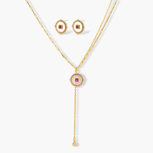 Gold-plated circular medallion necklace set with white enamel base and pink cubic zirconia accent stones