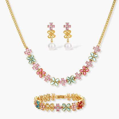 Gold-plated jewelry set with pink, turquoise and red flower-shaped cubic zirconia stones, featuring necklace, earrings and bracelet.