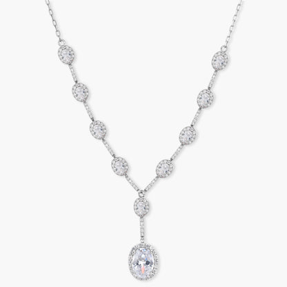 Elegant white gold plated jewelry set with oval cubic zirconia stones in halo settings, featuring Y-necklace and drop earrings.